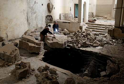 photo of collecting evidence in Iraqi ruins